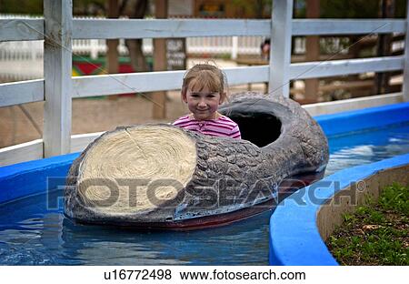 Stock Photo - Girl on log flume ride. Fotosearch
