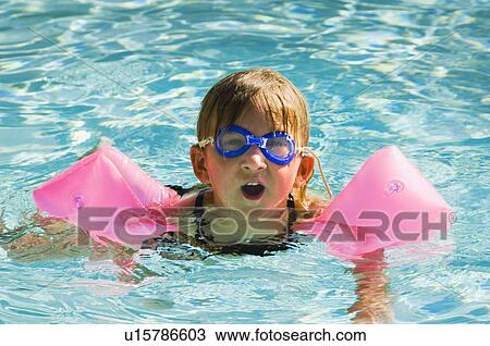 Stock Image - Girl swimming. Fotosearch