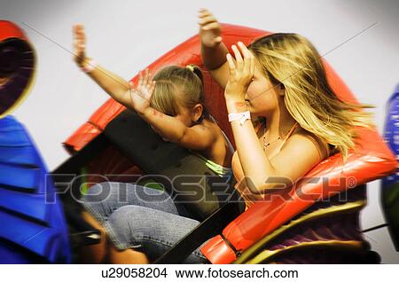 Picture - Kids on a carnival ride. Fotosearch
