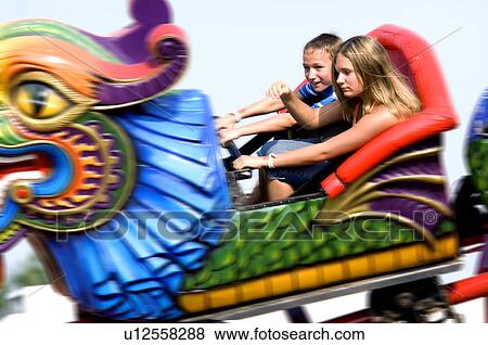 Kids on a carnival ride View Large Photo Image Stock Photo - Kids on a carnival ride. Fotosearch