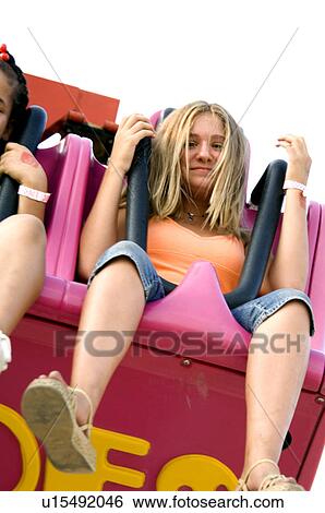 Stock Photograph - Kids on a carnival ride. Fotosearch