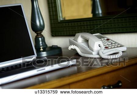 Stock Photo - Laptop computer on hotel desk. Fotosearch