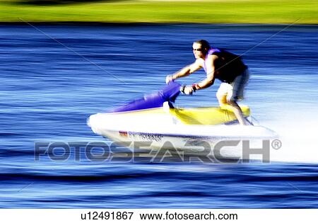 Stock Photo - Man on jet ski. Fotosearch