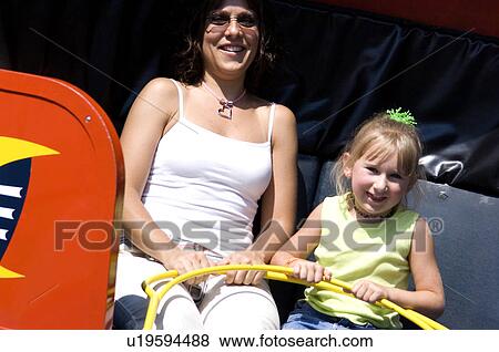 Mother and daughter on carnival ride View Large Photo Image Stock Photo - Mother and daughter on carnival ride. Fotosearch