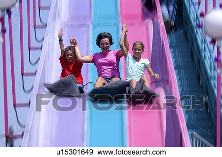 Stock Photo - People on carnival ride. Fotosearch
