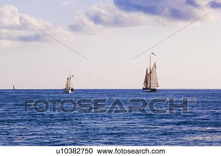 Sailboats on water View Large Photo Image Stock Image - Sailboats on water. Fotosearch