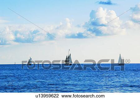 Sailboats on water View Large Photo Image Stock Image - Sailboats on water. Fotosearch