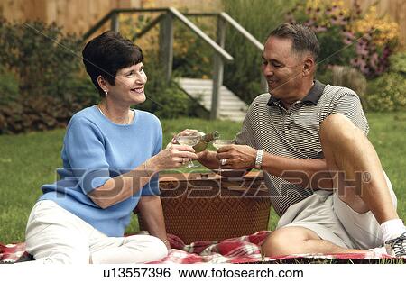 Senior couple having a picnic View Large Photo Image Stock Photograph - Senior couple having a picnic. Fotosearch