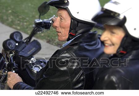 Stock Photograph - Senior couple on motorcycle. Fotosearch