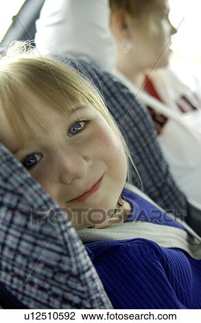 Stock Image - Toddler in car seat. Fotosearch