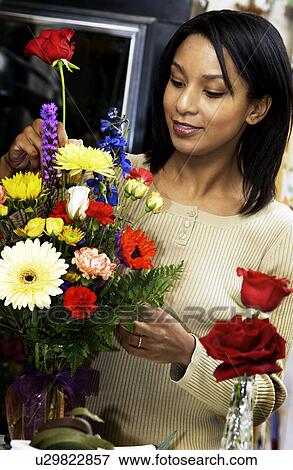 African American florist preparing floral arrangement View Large Photo Image Stock Photo - African American florist preparing floral arrangement. Fotosearch