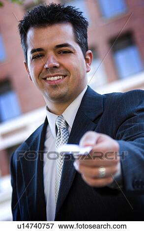 Stock Photo - Businessman handing out business card. Fotosearch