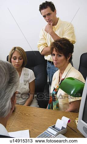 Stock Image - Family with doctor. Fotosearch