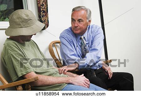 Picture - Man receiving counseling. Fotosearch