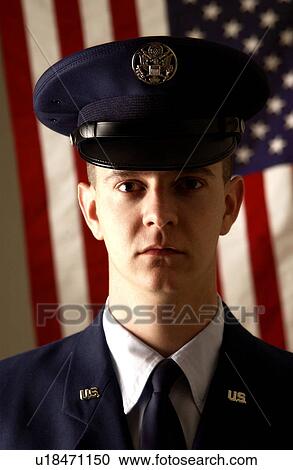 Soldier standing in front of American flag View Large Photo Image Stock Image - Soldier standing in front of American flag. Fotosearch