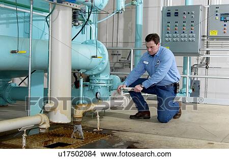 Picture - Water Department technician. Fotosearch