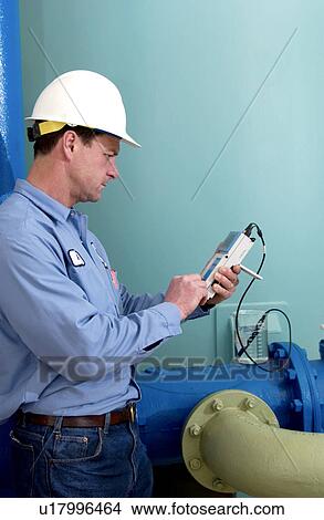 Picture - Water Department technician. Fotosearch