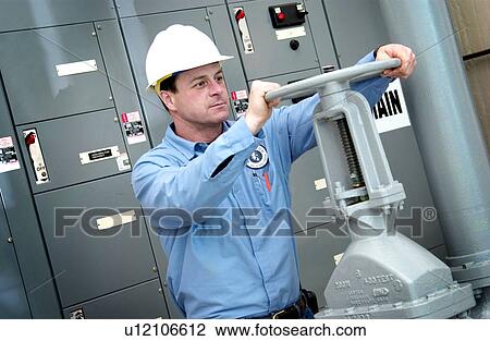 Stock Image - Water Department technician. Fotosearch