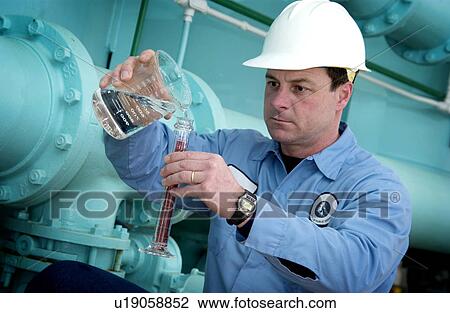 Stock Image - Water Department technician. Fotosearch