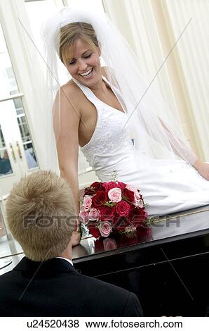 Bride and groom at piano View Large Photo Image Stock Photo - Bride and groom at piano. Fotosearch