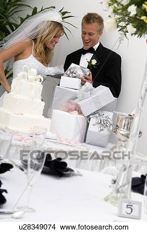 Bride and groom at wedding reception View Large Photo Image Picture - Bride and groom at wedding reception. Fotosearch