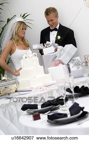 Bride and groom at wedding reception View Large Photo Image Stock Photo - Bride and groom at wedding reception. Fotosearch