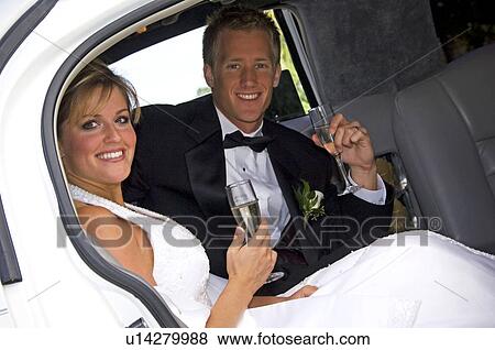 Bride and groom in limo View Large Photo Image Stock Photo - Bride and groom in limo. Fotosearch
