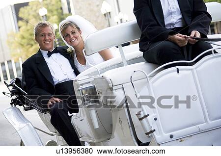 Bride and groom on horse and carriage ride View Large Photo Image Stock Image - Bride and groom on horse and carriage ride. Fotosearch