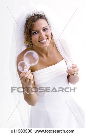 Bride blowing bubbles View Large Photo Image Stock Photograph - Bride blowing bubbles. Fotosearch