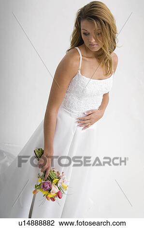 Bride holding bouquet View Large Photo Image Stock Image - Bride holding bouquet. Fotosearch