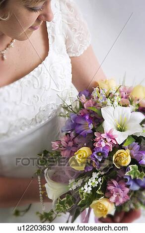 Bride with bouquet View Large Photo Image Stock Image - Bride with bouquet. Fotosearch