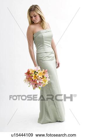 Bridesmaid holding bouquet View Large Photo Image Stock Photo - Bridesmaid holding bouquet. Fotosearch