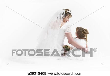 Flower girl and bride View Large Photo Image Stock Photo - Flower girl and bride. Fotosearch