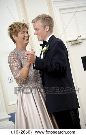 Stock Photo - Mother dancing with groom. Fotosearch
