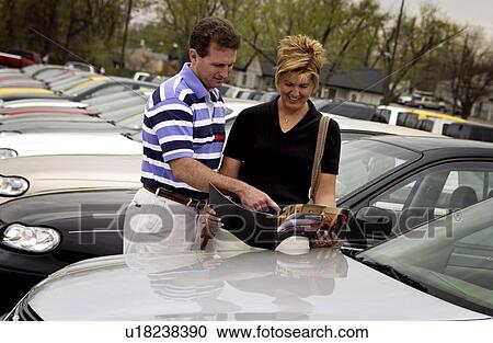 Stock Image - Couple car shopping. Fotosearch