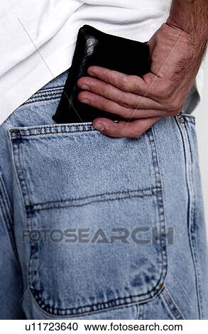 Man putting wallet in jeans pocket View Large Photo Image Stock Image - Man putting wallet in jeans pocket. Fotosearch