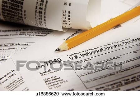 Stock Image - Tax paperwork. Fotosearch
