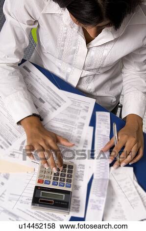 Woman paying bills Stock Photo | u14452158 | Fotosearch