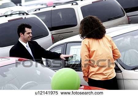 Woman purchasing a new car View Large Photo Image Stock Photography - Woman purchasing a new car. Fotosearch