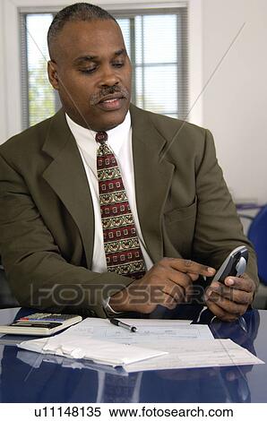 African American businessman on cordless phone View Large Photo Image Stock Photography - African American businessman on cordless phone. Fotosearch