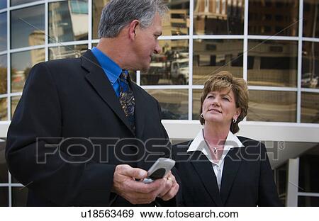 Stock Photo - Businessman and businesswoman. Fotosearch