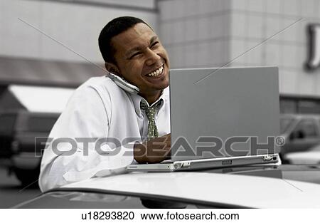 Businessman working on laptop View Large Photo Image Stock Image - Businessman working on laptop. Fotosearch