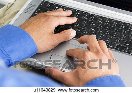 Stock Photo - Businessman working on laptop. Fotosearch