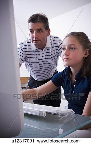 Father and daughter at computer View Large Photo Image Stock Image - Father and daughter at computer. Fotosearch