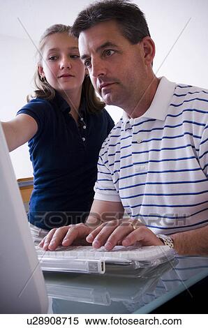 Father and daughter at computer View Large Photo Image Stock Photography - Father and daughter at computer. Fotosearch