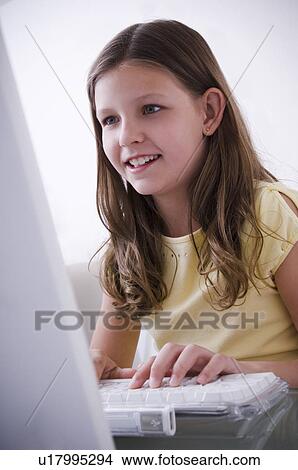 Picture - Girl at computer. Fotosearch