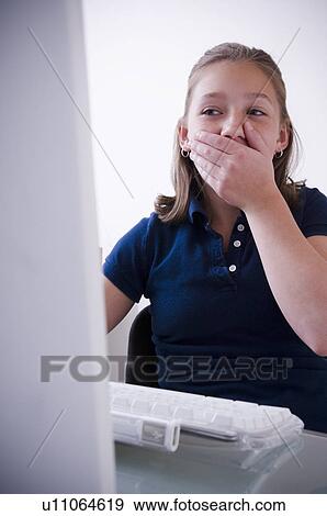 Stock Photo - Girl at computer. Fotosearch