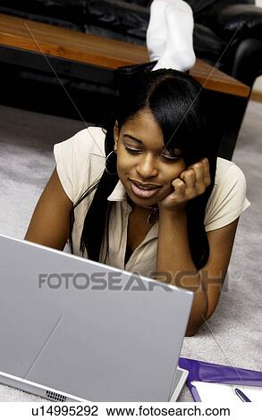 Stock Image - Girl at laptop. Fotosearch
