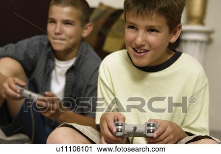 Kids playing video games View Large Photo Image Stock Image - Kids playing video games. Fotosearch