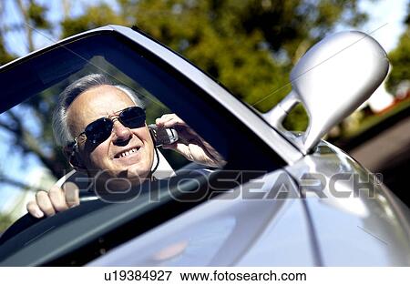 Stock Photo - Man in convertible. Fotosearch